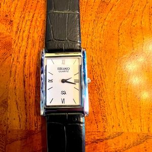 Seiko Quartz watch white face black band. Circa 2000.